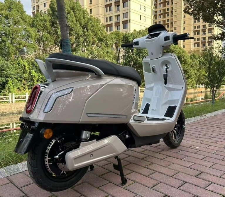 Sweeraj EV scooter parked in an urban environment